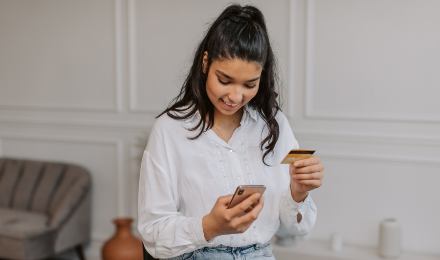 Woman Paying with Credit Card for Online Shopping